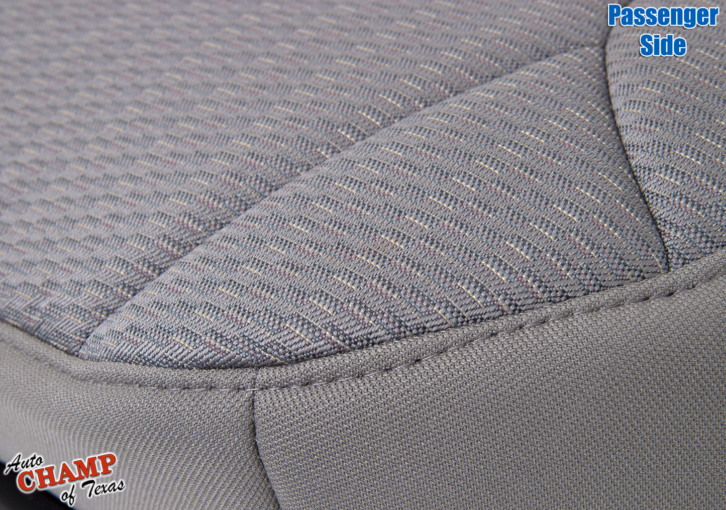 Close-up view of the passenger side bottom cloth seat cover for 2002-2004 Jeep Liberty in taupe.