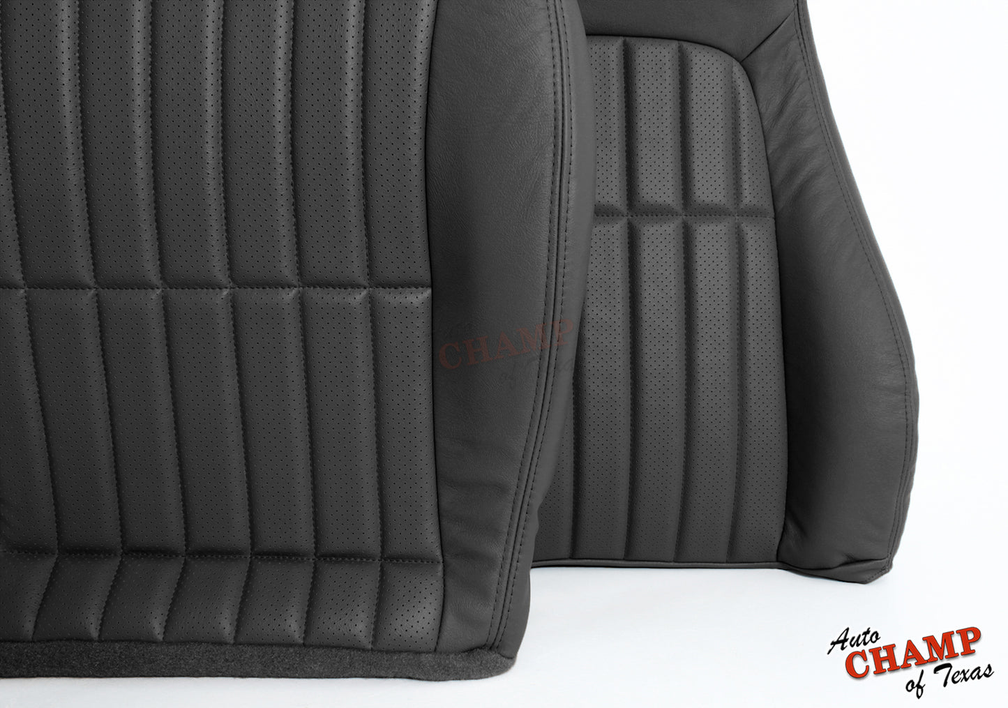 Close-up of black leather seat cover with vertical stitching and perforated panels.
