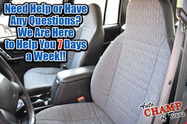 Gray cloth seat cover installed on driver-side seat in a vehicle interior.