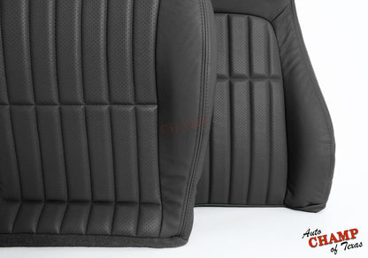 Close-up of black leather seat cover with vertical stitching and perforated panels.