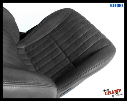 Worn gray perforated leather seat cover on driver side bottom before replacement for 1997-1999 models.